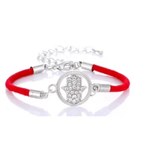 Fatima keze strasszköves kör medálos karkötő