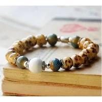 Barna porcelán karkötő levél mintás osztóval