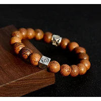 Fa mala OM osztóval karkötő