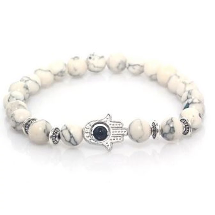 Fatima keze ezüst színű medállal, fehér gyöngy karkötő